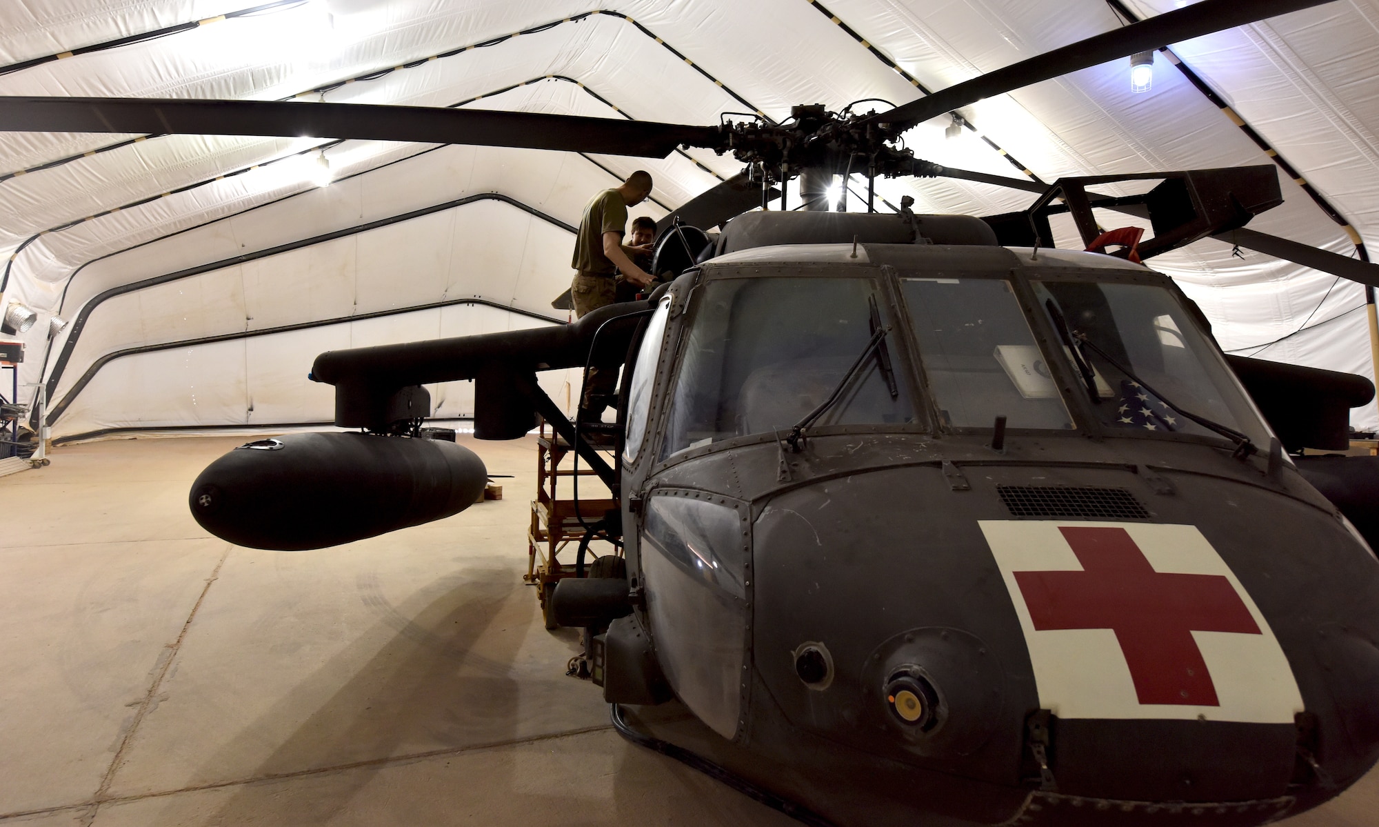 U.S. Army Soldiers from Task Force Javelin conduct maintenance on a UH-60 Blackhawk helicopter at Prince Sultan Air Base, Kingdom of Saudi Arabia