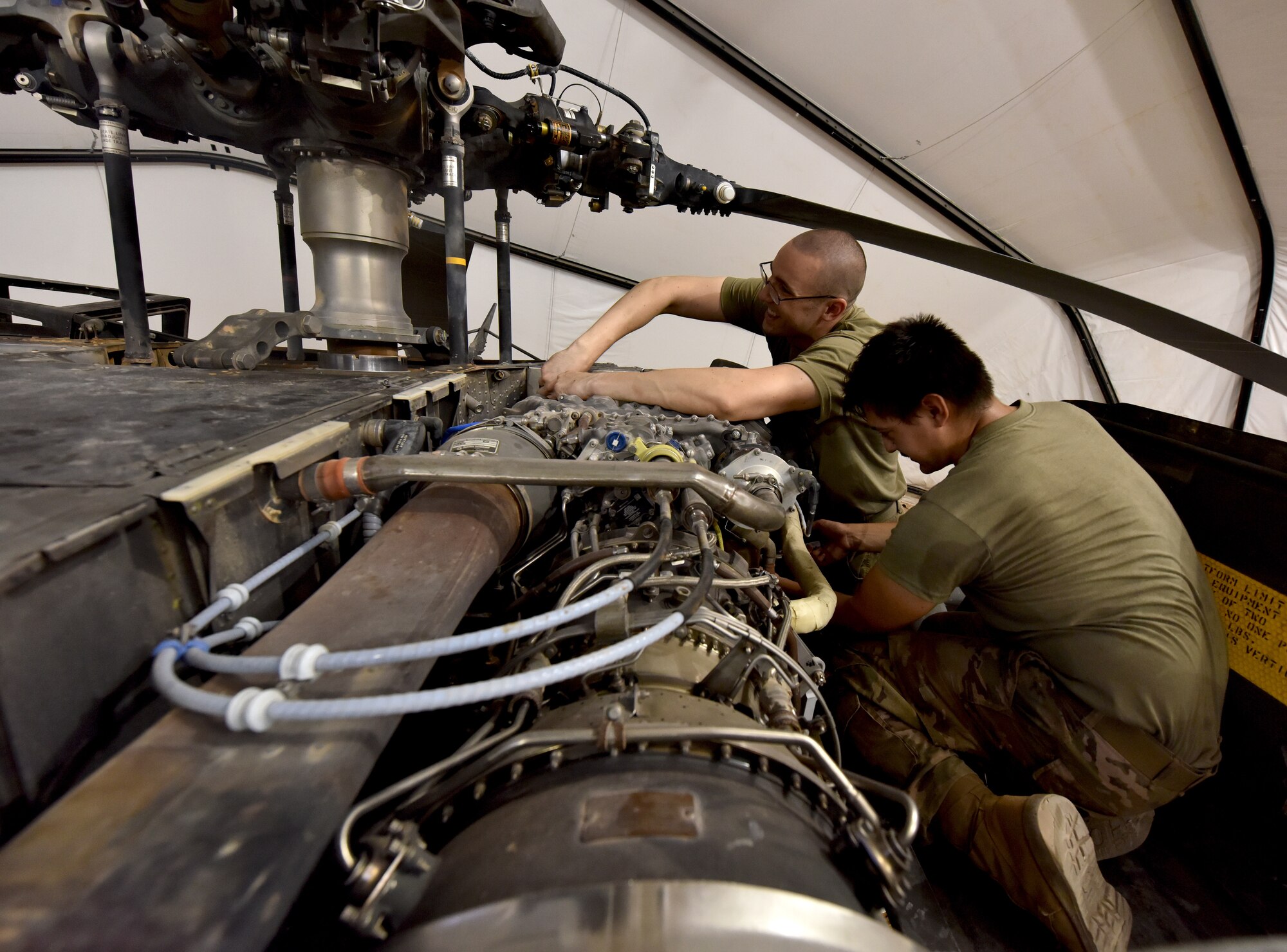 U.S. Army Soldiers from Task Force Javelin conduct maintenance on a UH-60 Blackhawk helicopter at Prince Sultan Air Base, Kingdom of Saudi Arabia