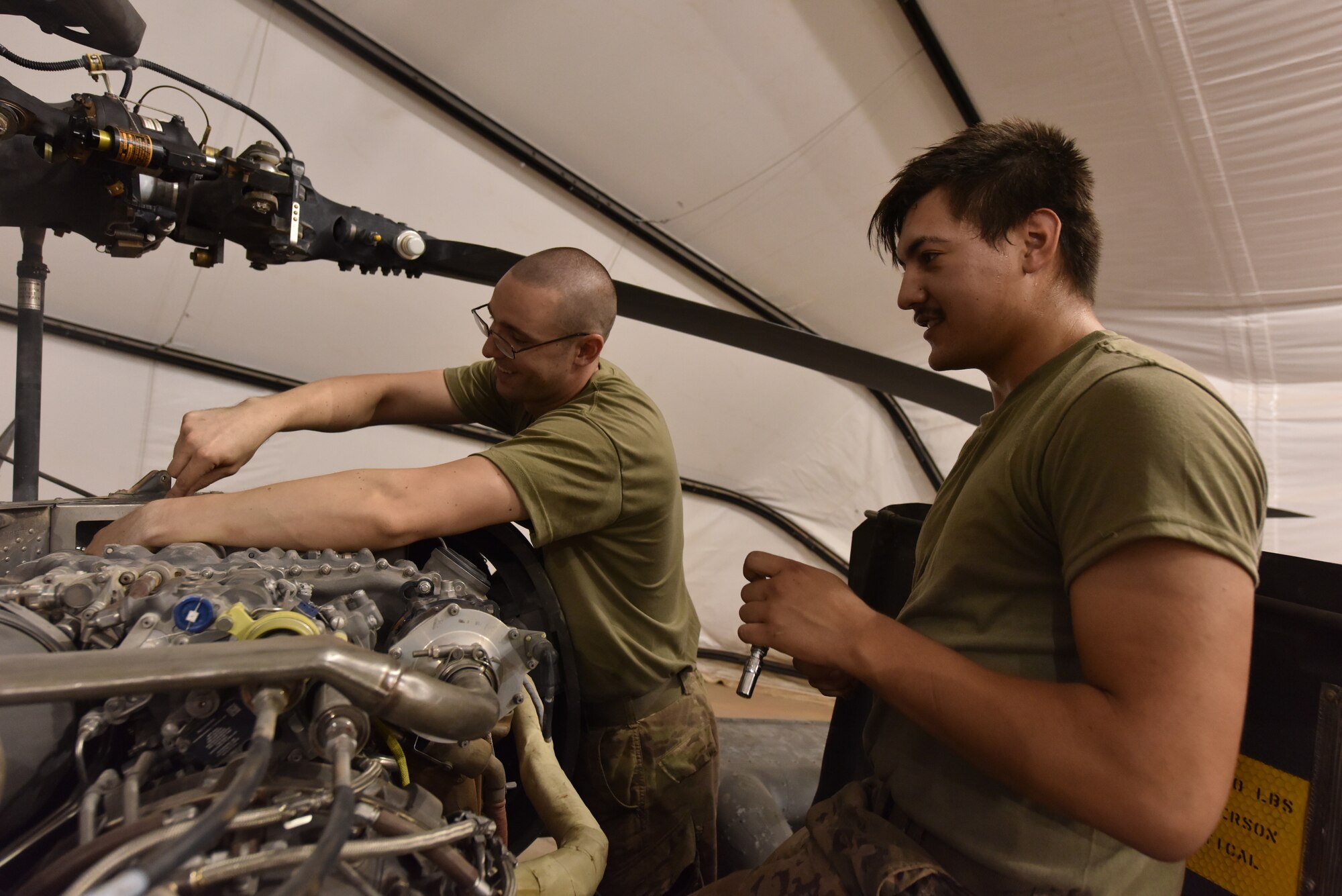 U.S. Army Soldiers from Task Force Javelin conduct maintenance on a UH-60 Blackhawk helicopter at Prince Sultan Air Base, Kingdom of Saudi Arabia