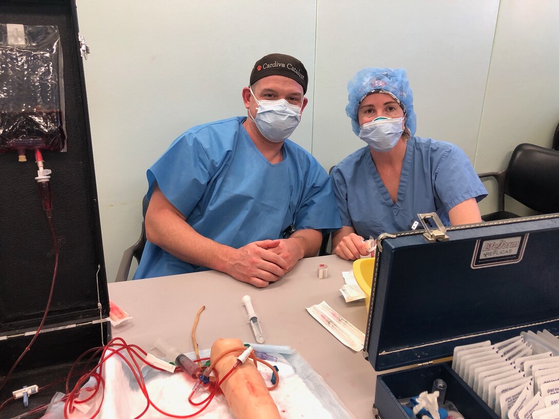 Capt. Jared Dykes and Maj. Kelly Prigge pose for a photo together while working at the Lincoln Medical Hospital.