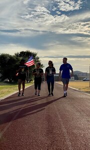 Participants walk the Warhawk Fitness Center track in shifts during a 37th Training Wing hosted 24-hour walk honoring fallen U.S. Army SPC Vanessa Guillen, 25-26 July, 2020. The event was a way for community participants to make a stand against injustice and reiterate the DoD's zero tolerance of sexual misconduct and interpersonal violence.