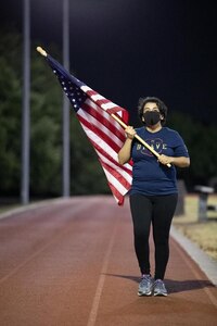 Participants walk the Warhawk Fitness Center track in shifts during a 37th Training Wing hosted 24-hour walk honoring fallen U.S. Army SPC Vanessa Guillen, 25-26 July, 2020. The event was a way for community participants to make a stand against injustice and reiterate the DoD's zero tolerance of sexual misconduct and interpersonal violence.