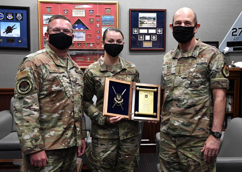 Chief Wade, Airman Jones and General Holmes pose for photograph