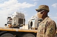 U.S. Army Spc. Eric S. Shepherd, 207th Regional Support Group services NCO, supervises the disposal of broken equipment at Al Asad Air Base, Iraq, July, 10, 2020. The Army Reserve unit provided life support services for three separate bases in Iraq through much of 2020 in support of Operation Inherent Resolve. Coalition Forces continue to work with allies and partners for a unified and determined mission to degrade and defeat Daesh. The unit is based in Fort Jackson, S.C. (U.S. Army photo by Sgt. 1st Class Gary A. Witte, 207th Regional Support Group)