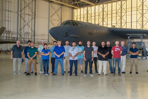 Members of the Bomber Instrumentation Team, 812th Aircraft Instrumentation Test Squadron, pose for a group photo in front of a B-52 Stratofortress at Edwards Air Force Base, California, Aug. 5, 2019. (Air Force photo by Ethan Wagner)