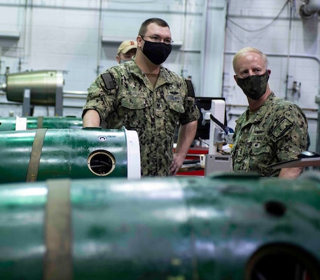 Torpedoman 1st Class Gary Anderson explains the components of a Mark 48 torpedo.