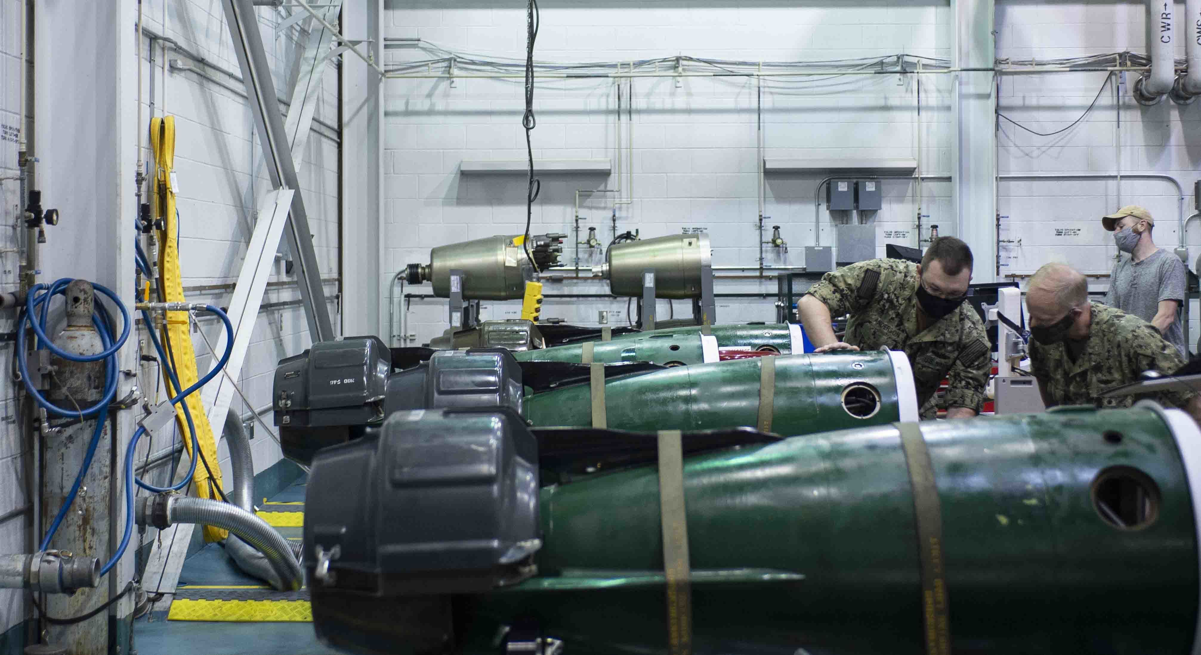 Torpedoman 1st Class Gary Anderson explains the components of a Mark 48 torpedo.
