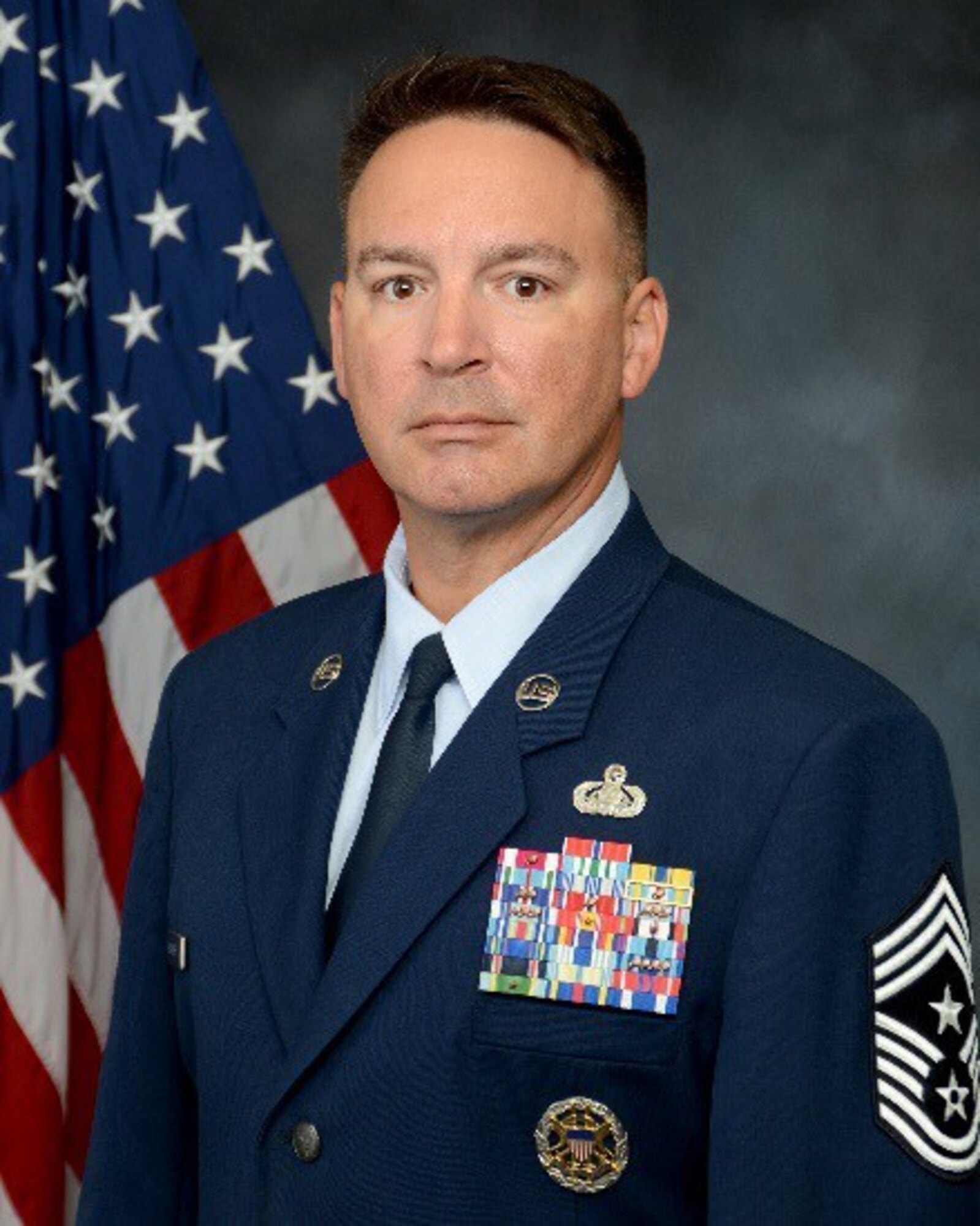 Chief Master Sgt. Brian Bischoff, 960th Cyberspace Wing command chief, stands for an official photo. (U.S. Air Force courtesy photo)