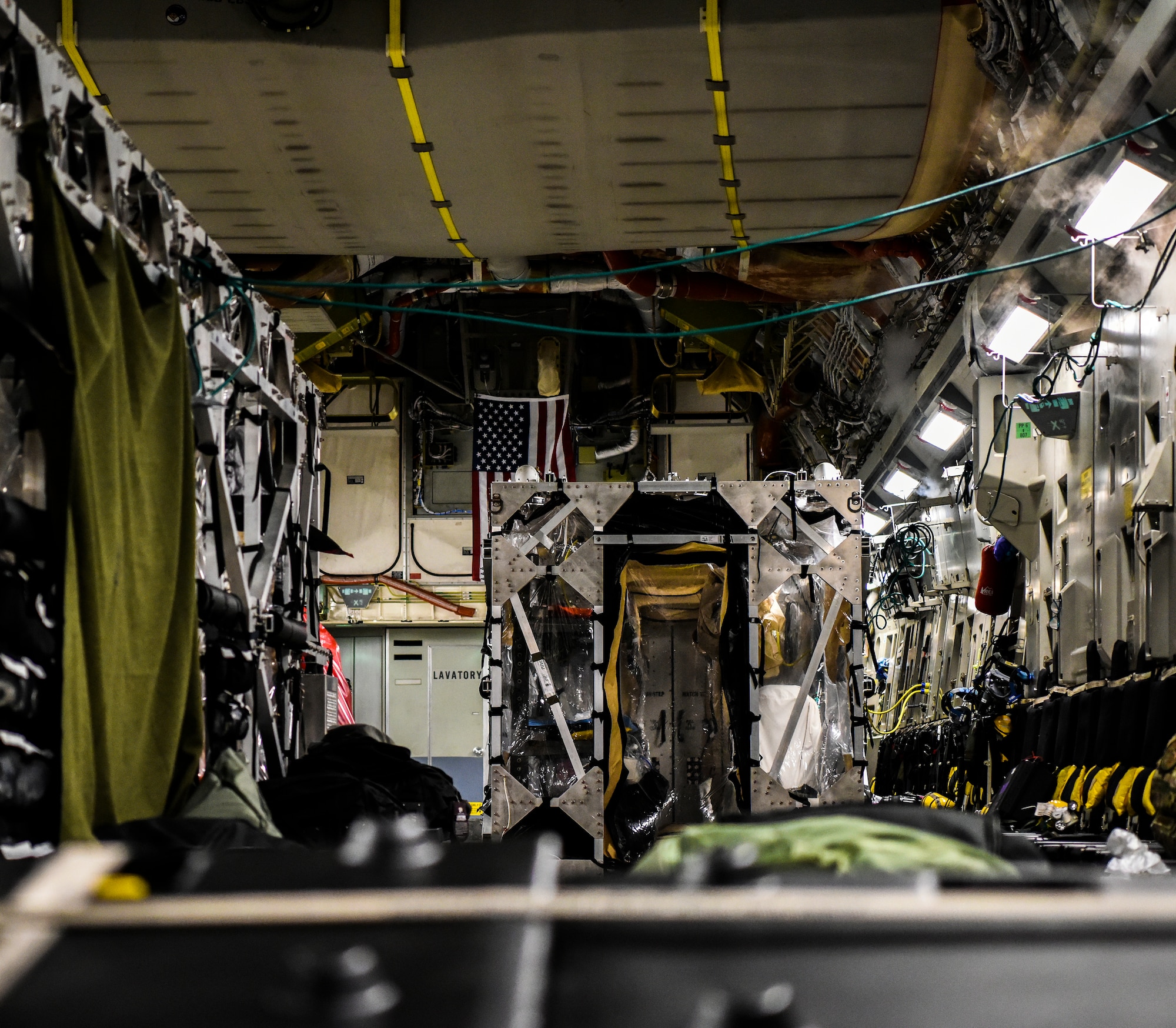 A 60th Air Mobility Wing C-17 from Travis Air Force Base, California, support a Transport Isolation System operation at Joint Base Pearl-Harbor Hickam, Hawaii, July 17, 2020. A team of Airmen from several commands rapidly executed a Transport Isolation System in support of a COVID-19 bio-containment aeromedical evacuation mission. This is the first time the TIS was utilized in the Indo-Pacific area of operations. The TIS is an infectious disease containment unit designed to minimize contamination risk to aircrew and medical attendants, while allowing in-flight medical care for patients afflicted by a disease. (U.S. Air Force photo by Tech. Sgt. Anthony Nelson Jr.)