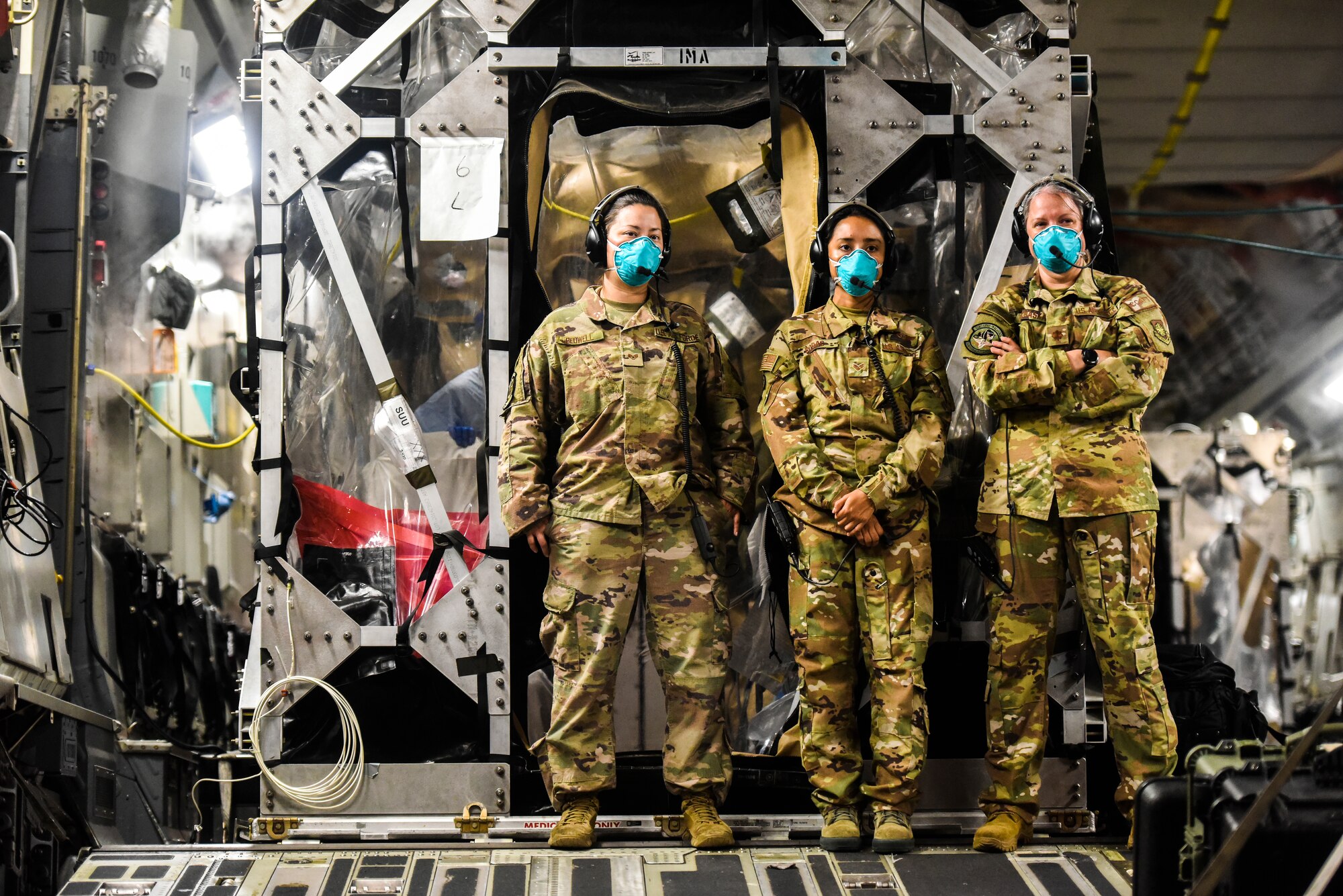 An Aeromedical Evacuation unit from Travis Air Force Base, California, support a Transport Isolation System operation at Joint Base Pearl-Harbor Hickam, Hawaii, July 17, 2020. A team of Airmen from several commands rapidly executed a Transport Isolation System in support of a COVID-19 bio-containment aeromedical evacuation mission. This is the first time the TIS was utilized in the Indo-Pacific area of operations. The TIS is an infectious disease containment unit designed to minimize contamination risk to aircrew and medical attendants, while allowing in-flight medical care for patients afflicted by a disease. (U.S. Air Force photo by Tech. Sgt. Anthony Nelson Jr.)