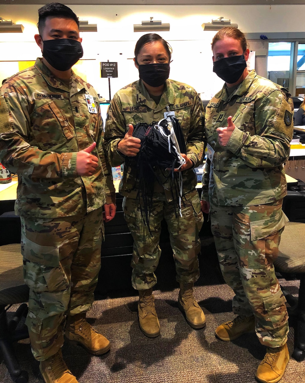 Soldiers wearing donated masks pose for a photo.