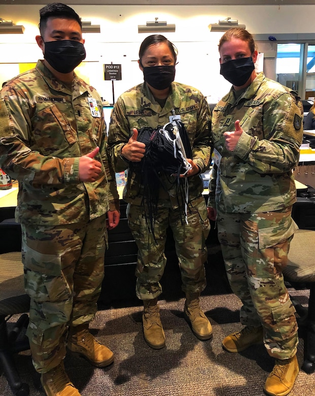 Soldiers wearing donated masks pose for a photo.