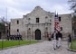 Sailors marching near old building