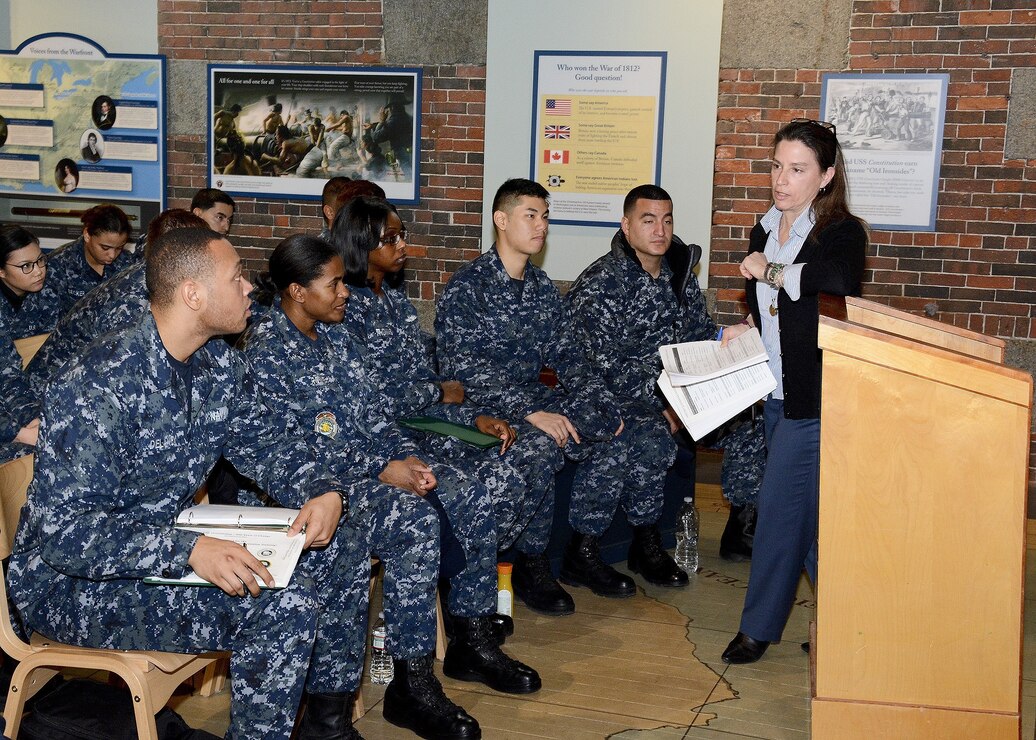 historian at Naval History & Heritage Command (NHHC) Detachment Boston, instructs the crew members of USS Constitution as part of the crew's continuing education of Old Ironsides' history