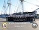 USS Constitution's crew poses for the 2017 command winter photo front of docked ship