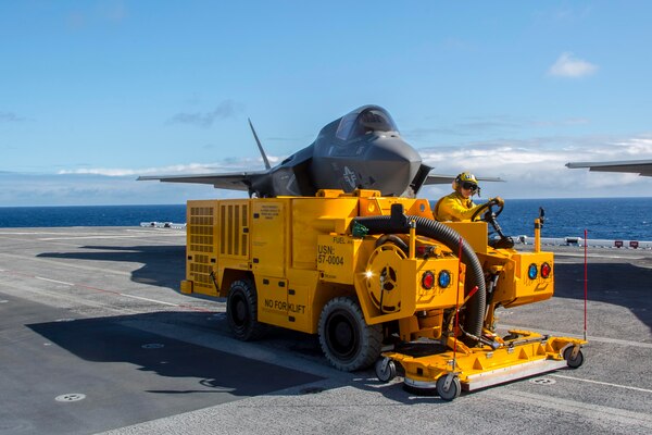 A Sailor operates the Mobile Cleaning, Recovery, and Recycling System (MCRRS) on the flight deck of USS America (LHA 6) on Nov. 1, 2016.