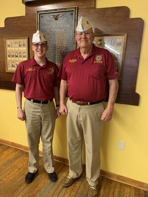 Senior Airman Donald Lambert, a services journeyman with the 130th Force Support Squadron, poses for a photo with an American Legion representative following a meeting. Lambert is the recipient of the 2020 American Legion Spirit of Service Award. (Courtesy photo)