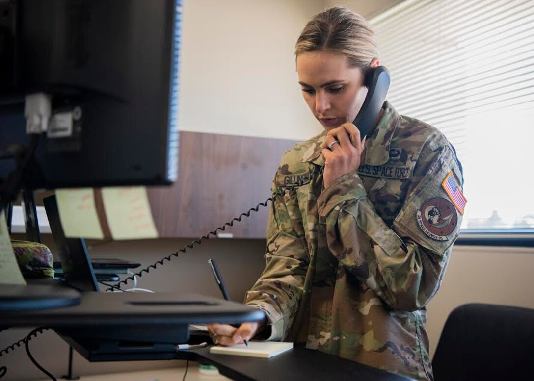 2nd Lt. Olivia Gillingham, 2d Space Launch Squadron acquisitions manager, works at her desk July 21, 2020, at Vandenberg Air Force Base, Calif. Upon graduation from the Air Force Academy, Gillingham was given the opportunity to commission into the U.S. Space Force on April 18, 2020. She now serves as a project manager at the 2d SLS. Gillingham is the first USSF member to be assigned to Vandenberg AFB. (U.S. Air Force photo by Senior Airman Hanah Abercrombie)