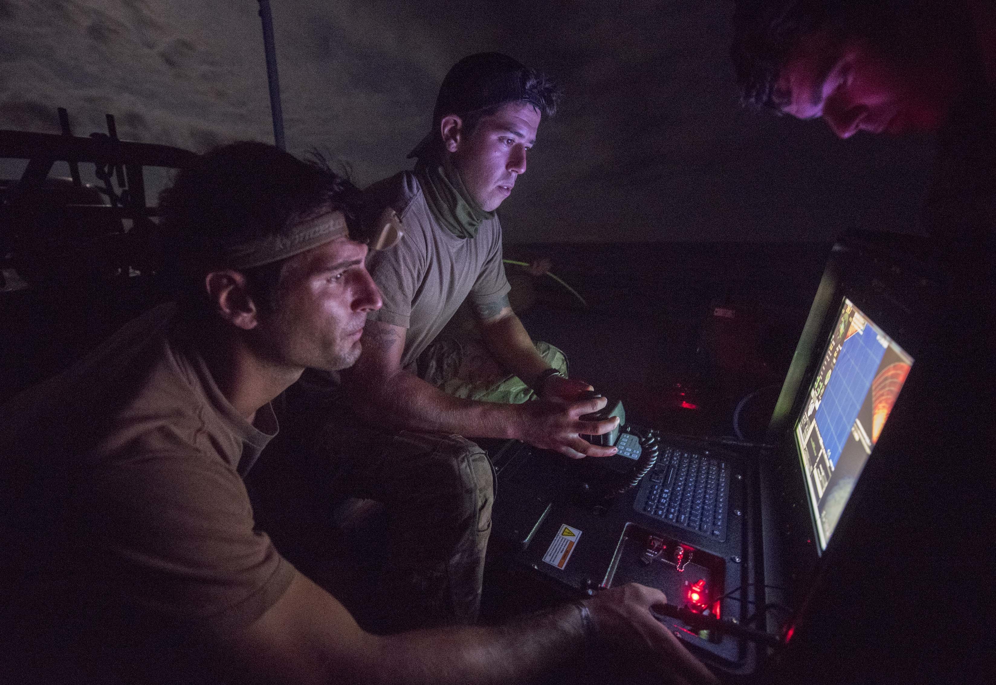 sailors monitoring the radar for mines