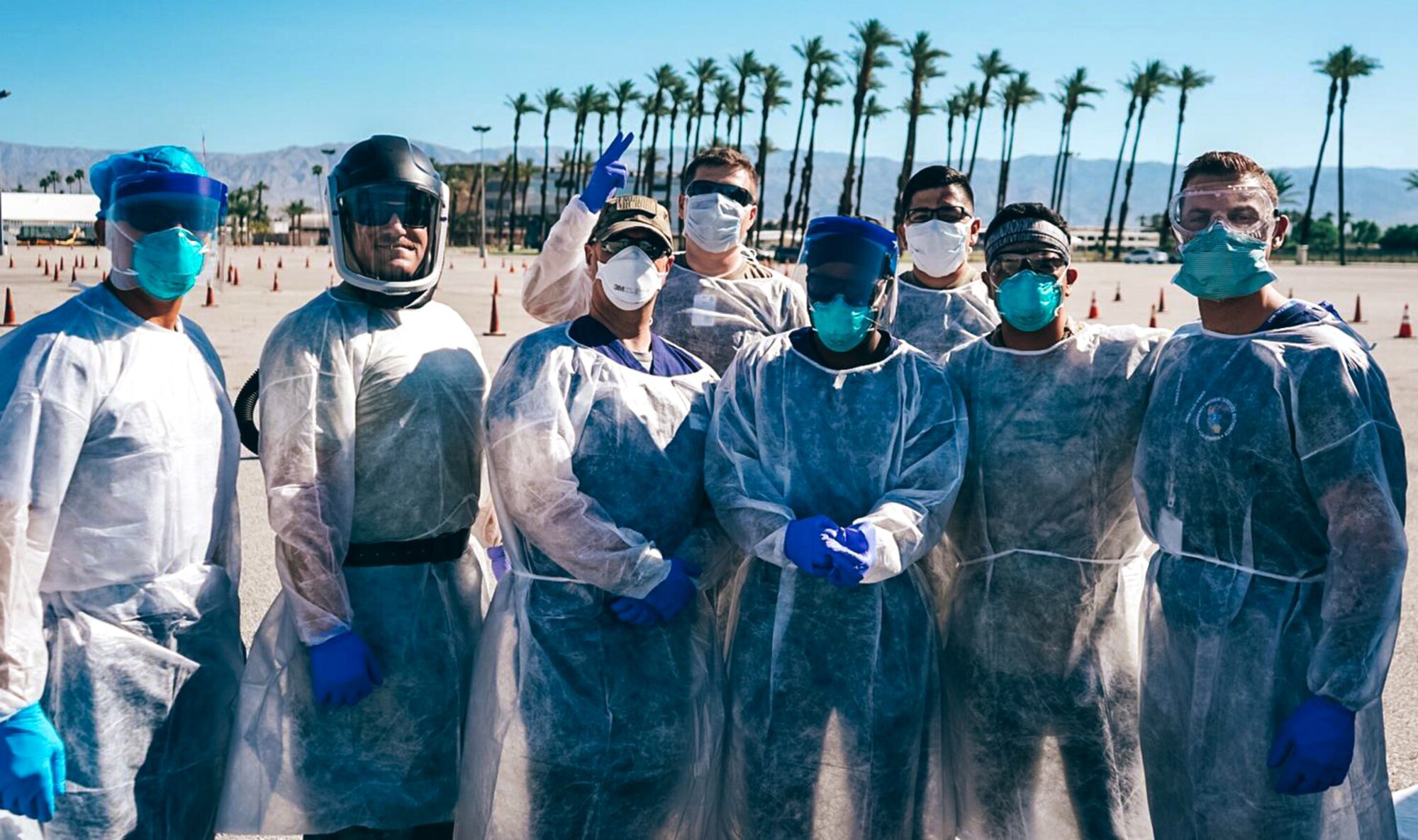 U.S. Air Force Capt. McGar (second from the left) stands with his fellow 144th Fighter Wing medical strike team members at a COVID-19 drive-thru testing site in Indio, Calif.