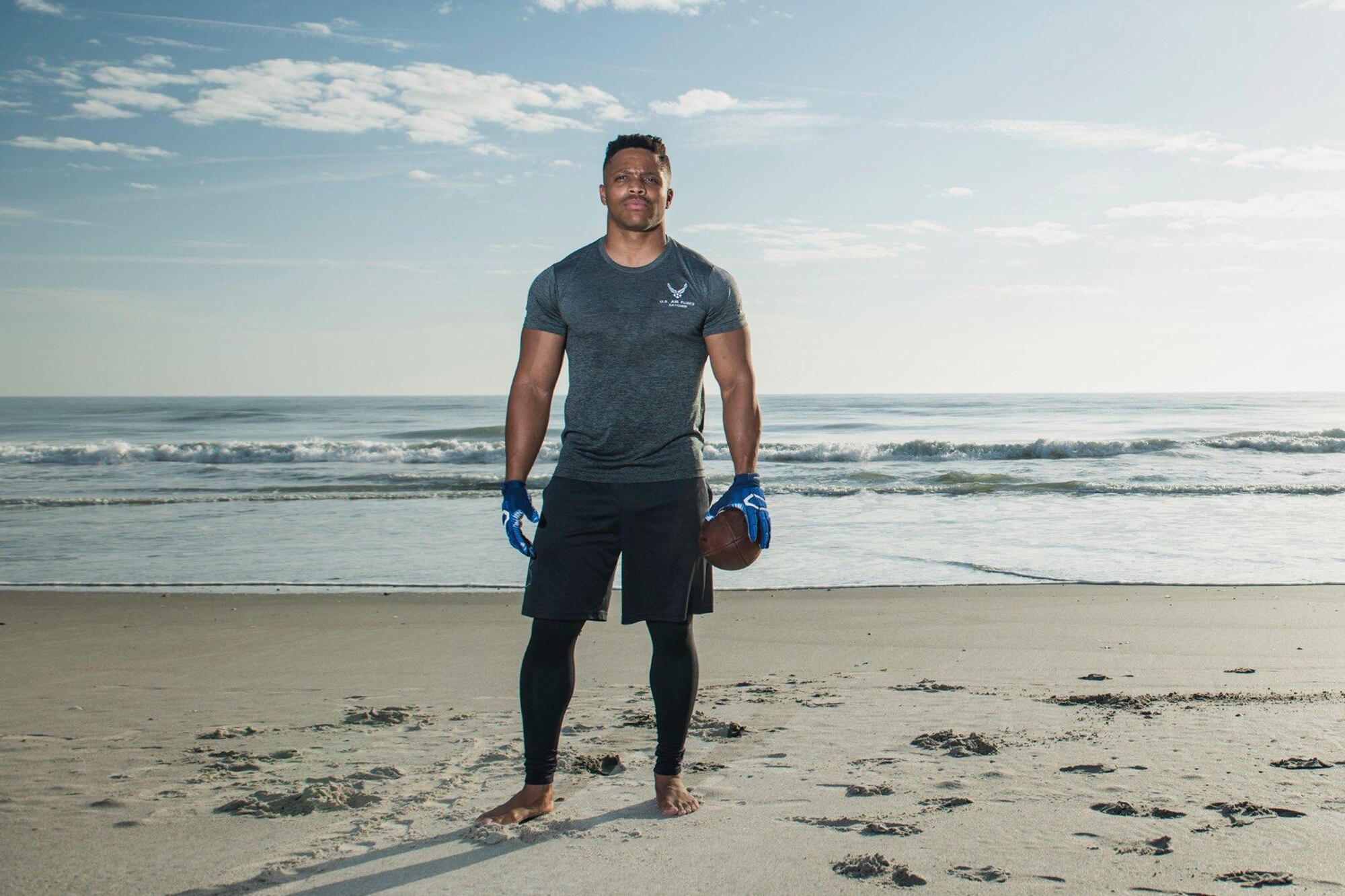 Staff Sgt. Geremy Satcher, a meteorologist and data analyst at the Air Force Technical Applications Center at Patrick Air Force Base, Florida, poses on the beach in Cocoa Beach prior to attending American National Combines in his pursuit of being picked up by a National Football League team.