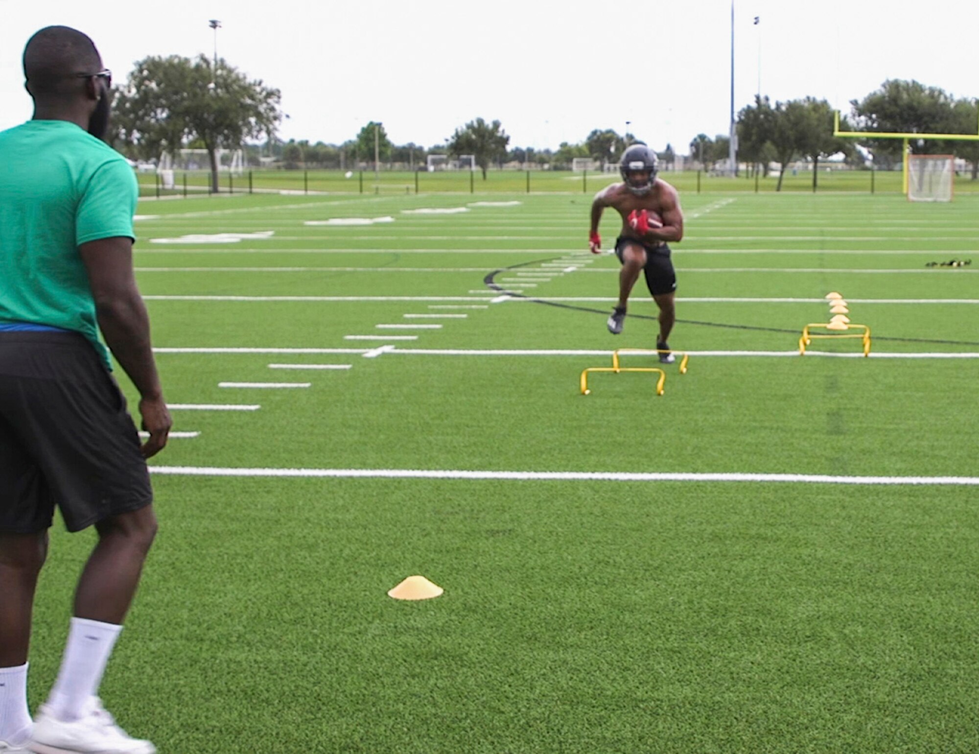 Staff Sgt. Geremy Satcher, a meteorologist and data analyst at the Air Force Technical Applications Center at Patrick Air Force Base, Florida, trains prior to the American National Combines with his personal trainer.