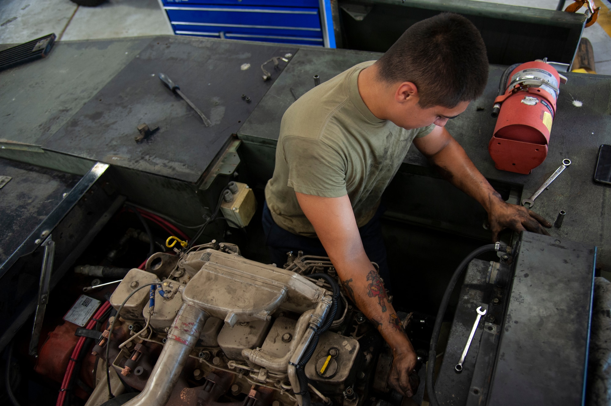 U.S. Air Force Airman 1st Class Sebastian Nucatola, a 6th Logistics Readiness Squadron vehicle mechanic, loosens a bolt on an MB-2 aircraft tow tractor, July 15, 2020, at MacDill Air Force Base, Fla.