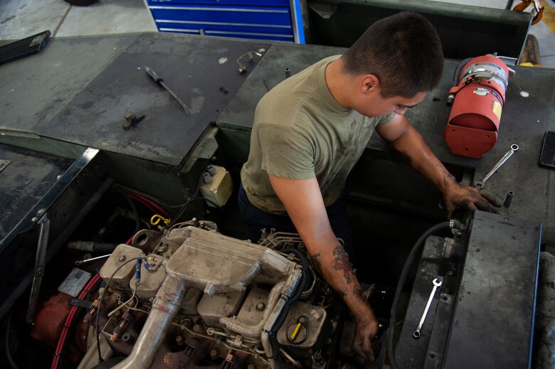 U.S. Air Force Airman 1st Class Sebastian Nucatola, a 6th Logistics Readiness Squadron vehicle mechanic, loosens a bolt on an MB-2 aircraft tow tractor, July 15, 2020, at MacDill Air Force Base, Fla.