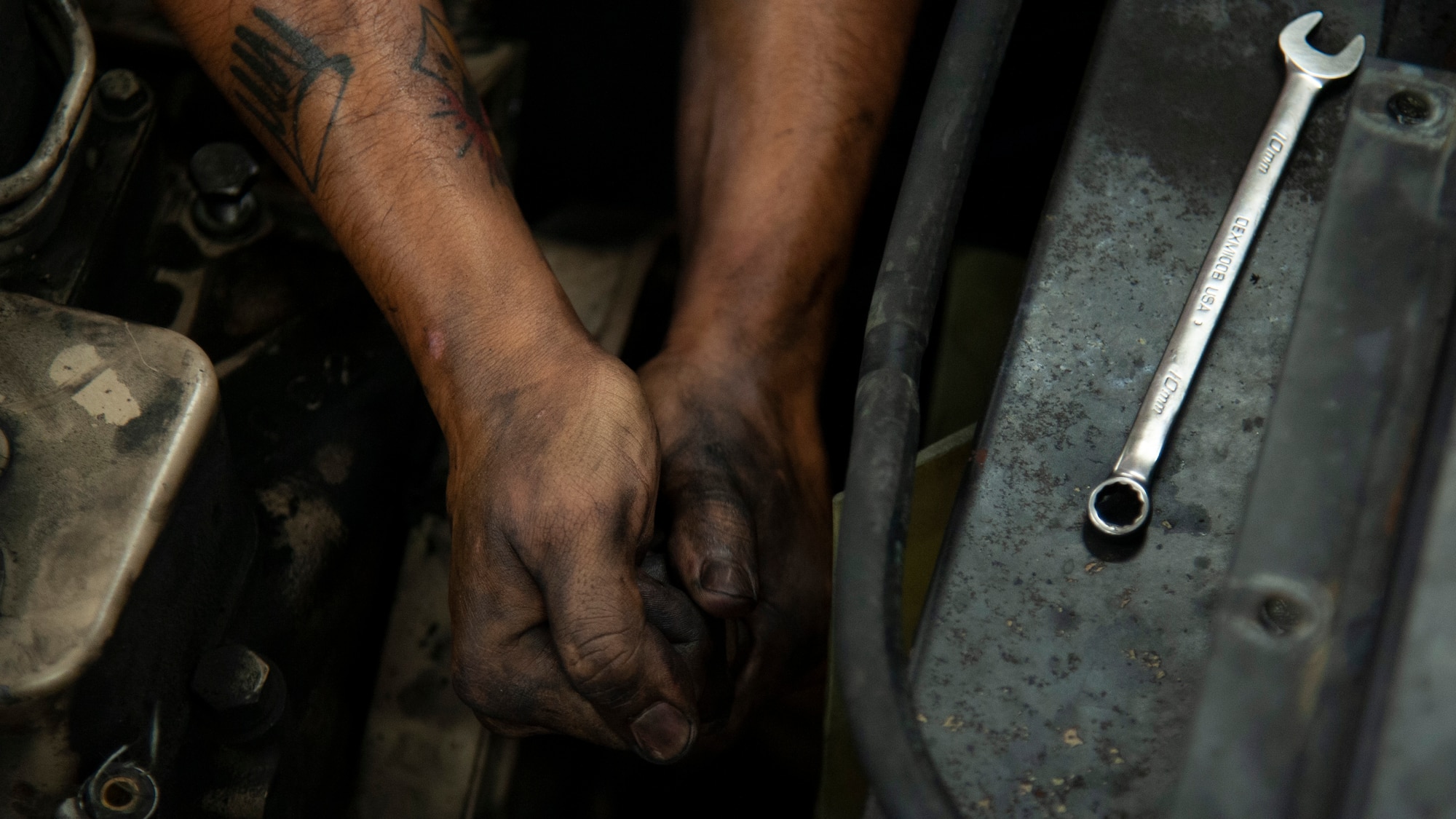 U.S. Air Force Airman 1st Class Sebastian Nucatola, a 6th Logistics Readiness Squadron vehicle mechanic, loosens a bolt on an MB-2 aircraft tow tractor, July 15, 2020, at MacDill Air Force Base, Fla.