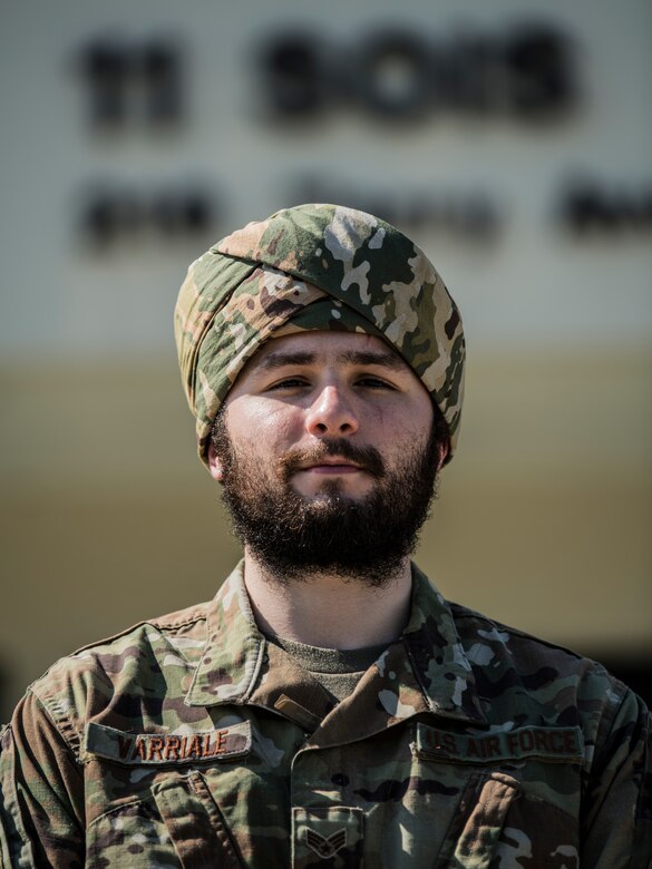 One man standing in front of a building.
