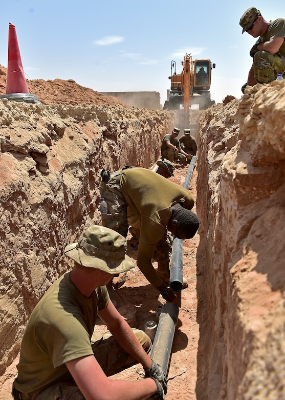 Airmen from the 378th Expeditionary Civil Engineer Squadron construct water and sewer lines at Prince Sultan Air Base, Kingdom of Saudi Arabia, July 28th, 2020.