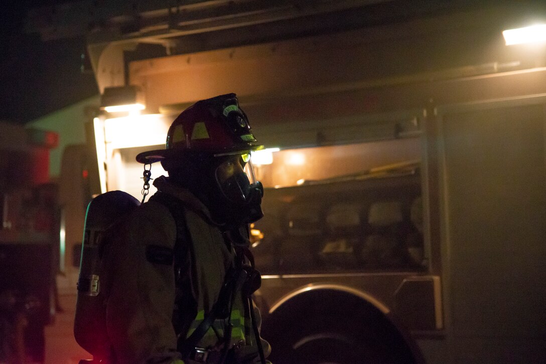A 379th Expeditionary Civil Engineer Squadron firefighter, stands by after a fire safety exercise response at Al Udeid Air Base, Qatar, July 24, 2020. Al Udeid AB conducts routine exercises that evaluate and prepare service members to keep them lethal and ready.