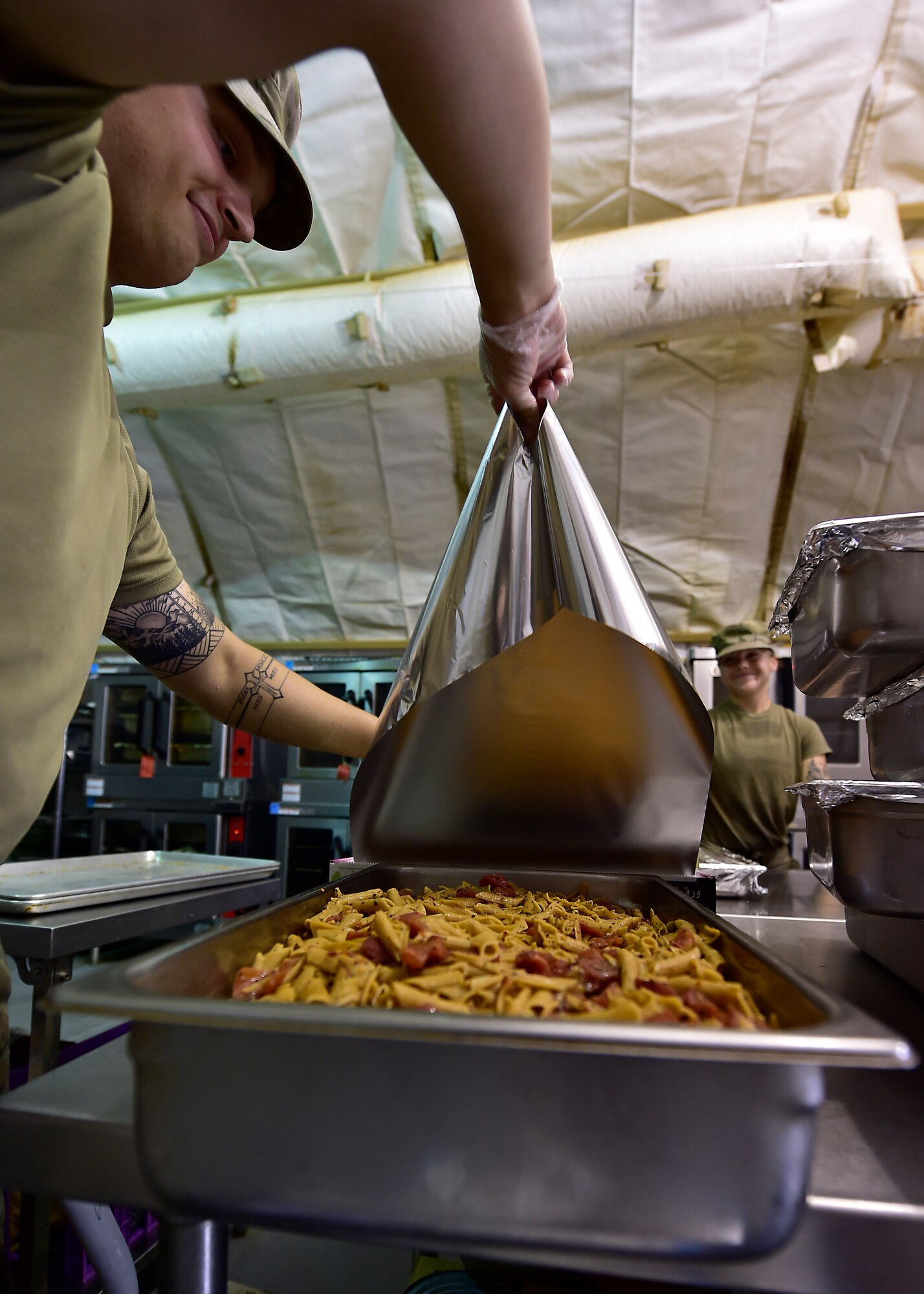Airmen from the 378th Expeditionary Force Support Squadron services section prepare and serve lunch to base personnel.