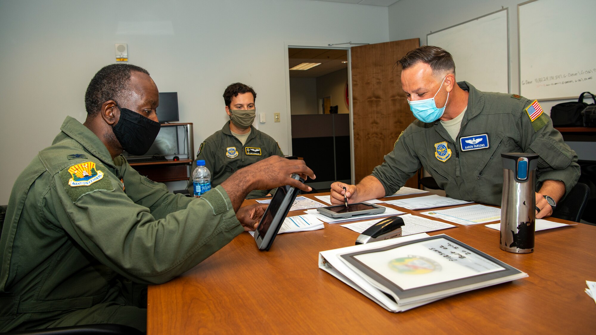 From left, U.S. Air Force Col. Travis Edwards, the acting 6th Air Refueling Wing vice commander, Senior Airman Luke Kornelson, a 91st Air Refueling Squadron boom operator, and Maj. Aaron Parsons, the 6th Operations Group chief of standardization and evaluation, brief for a flight at MacDill Air Force Base, Fla., Jul. 20, 2020.