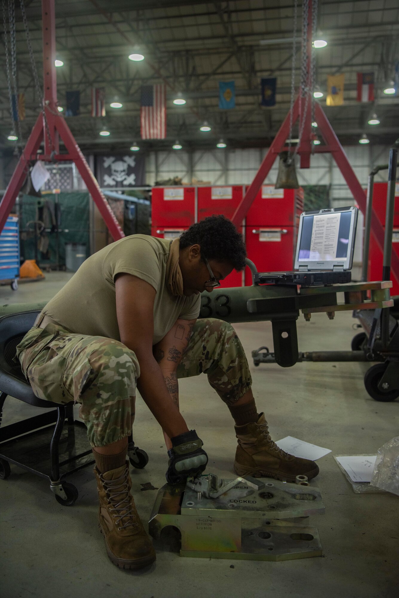 Senior Airman Nnkeha Streeter, 100th Maintenance Squadron aerospace ground equipment journeyman, assembles a tow bar July 28, 2020, at RAF Mildenhall, England. The AGE flight maintains the ground equipment other maintainers utilize to work on aircraft. (U.S. Air Force photo by Airman 1st Class Joseph Barron)