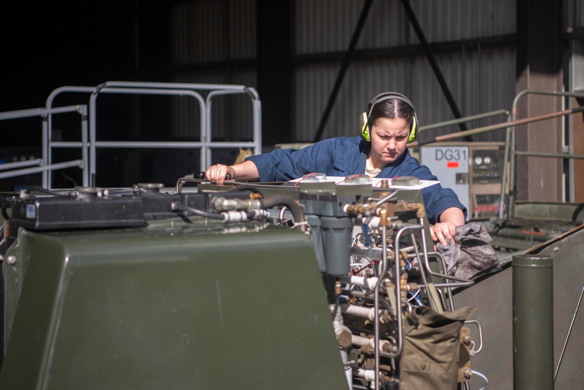 Airman 1st Class Miranda Purdie, 100th Maintenance Squadron aerospace ground equipment journeyman, powers off a nitrogen cart after a leak inspection July 28, 2020, at RAF Mildenhall, England. Functioning nitrogen carts enable the inflation of KC-135 Stratotanker tires. (U.S. Air Force photo by Airman 1st Class Joseph Barron)