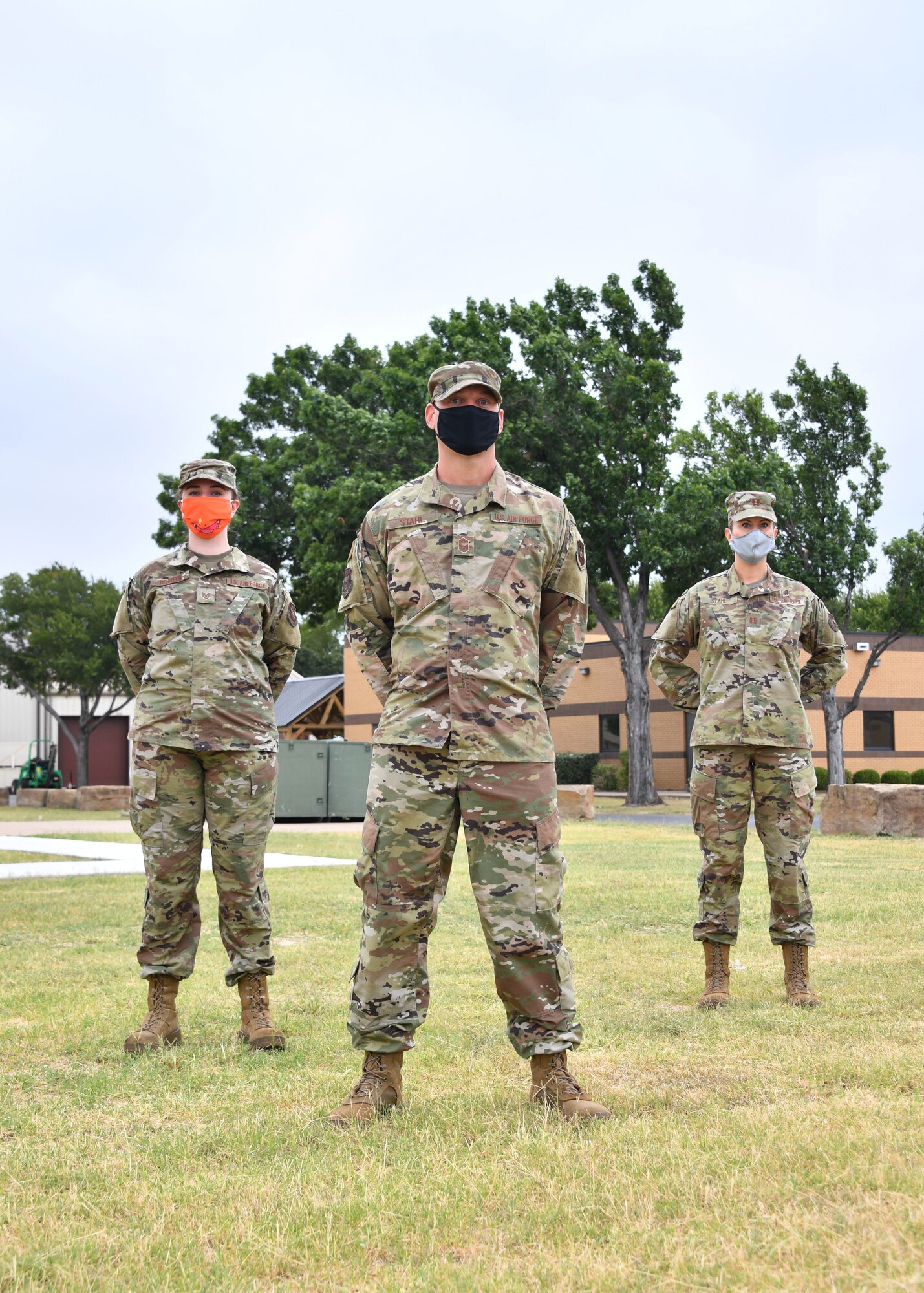 (left to right) U.S. Air Force Staff Sgt. Amanda Rehberg, left, 301st Force Support Squadron noncommissioned in-charge of customer support, Senior Master Sgt. Matthew Stahl, 301st Fighter Wing Staff occupational safety superintendent, and Capt. Lara Stahl, 301st Medical Squadron officer in-charge of immunizations, serve as a family at U.S. Naval Air Station Joint Reserve Base Fort Worth, Texas. They have 34 years of combined service. (Photo by Senior Airman Kedesha Pennant)