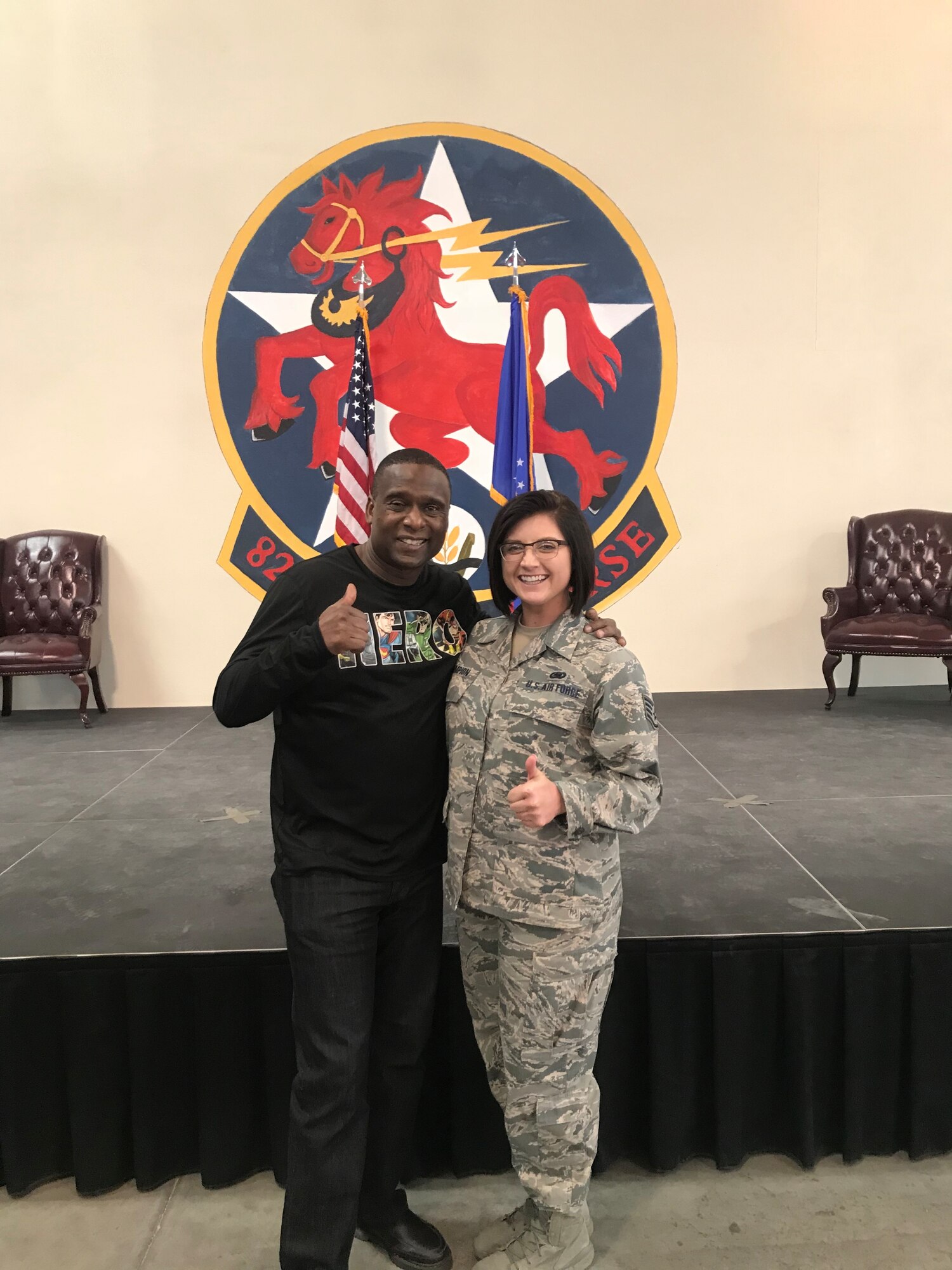 U.S. Air Force Staff Sgt Kaylee Champion poses for a photo with her mentor, retired Chief Master Sgt. Juan Lewis, "The Fired Up Chief." (Courtesy photo).