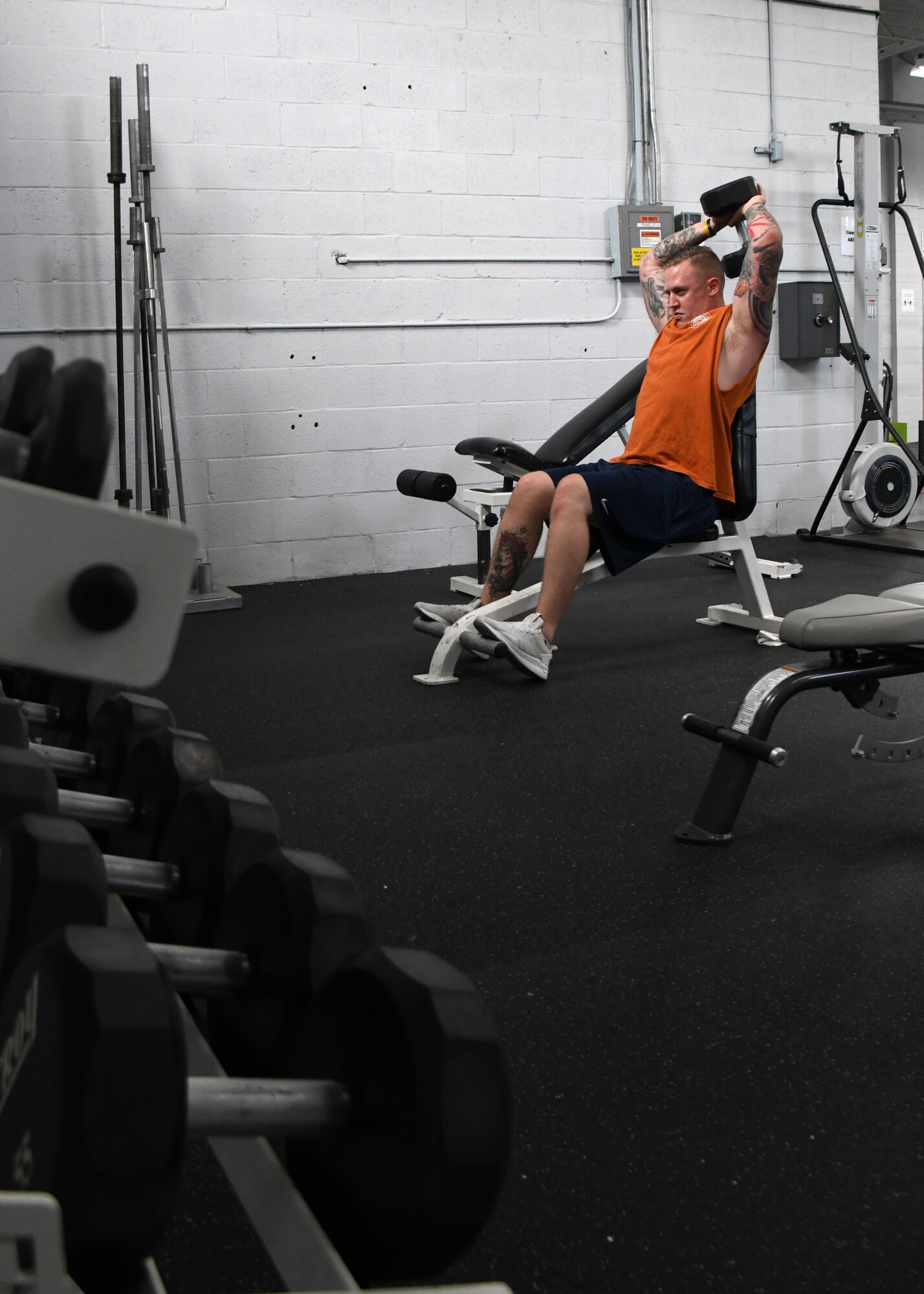 Staff Sgt. Brett Plotniak, 104th Fighter Wing Non-Destructive Inspection technician, works out in the base fitness room, July 28, 2020, at Barnes Air National Guard Base, Massachusetts. Due to the COVID-19 pandemic, wing members who choose to work out need to sign in and follow stricter guidelines in order to maintain a safe and healthy environment.  (U.S. Air National Guard photo by Senior Airman Sara Kolinski)