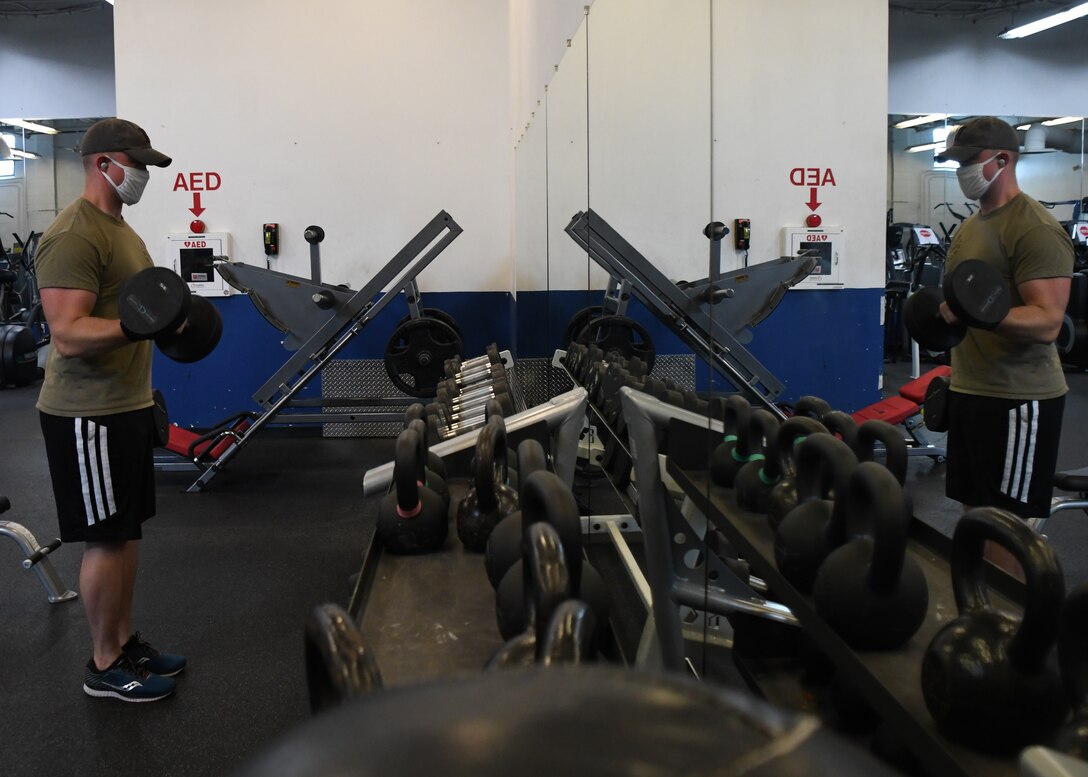 Technical Sergeant Wes Sobczyk, 104th Fighter Wing cyber transport technician, works out in the base fitness room, July 28, 2020, at Barnes Air National Guard Base, Massachusetts. Due to the COVID-19 pandemic, wing members who choose to work out need to sign in and follow stricter guidelines in order to maintain a safe and healthy environment.  (U.S. Air National Guard photo by Senior Airman Sara Kolinski)