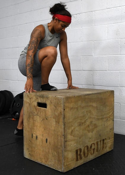 Airman 1st Class Yadira Garcia, 104th Fighter Wing Security Forces Squadron defender, stretches before a workout in the base fitness room, July 28, 2020, at Barnes Air National Guard Base, Massachusetts. Due to the COVID-19 pandemic, wing members who choose to work out need to sign in and follow stricter guidelines in order to maintain a safe and healthy environment.  (U.S. Air National Guard photo by Senior Airman Sara Kolinski)