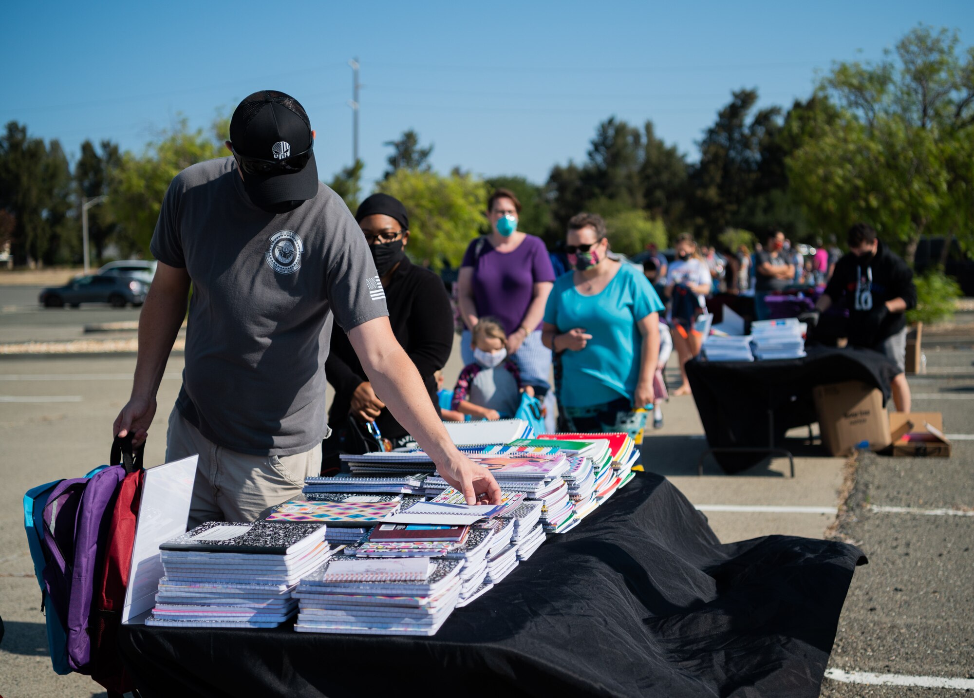 Military families receive back to school goods during an event.