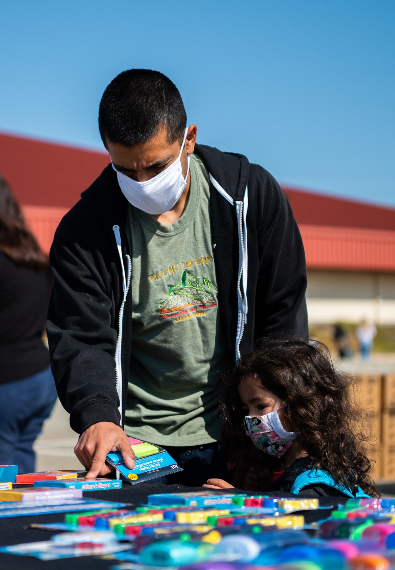 Military families receive back to school goods during an event.