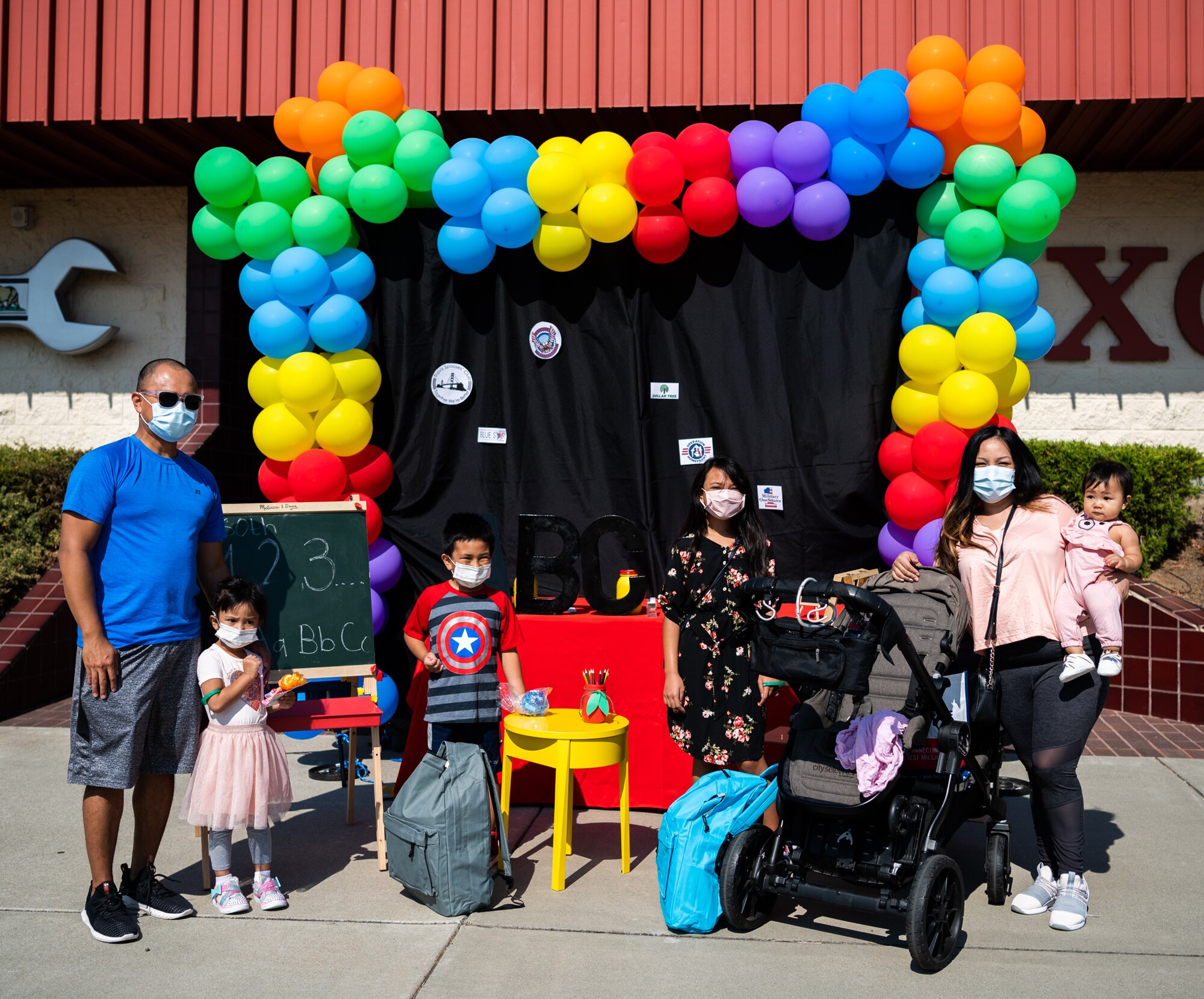 Military families receive back to school goods during an event.