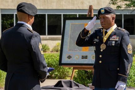 Recently retired Sgt. Maj. Ronald Houston, U.S. Army Financial Management Command Operations senior enlisted advisor, salutes the American flag as he an Master Sgt. L. Alphanzo Hunter take part in the “Old Glory” portion of Houston’s retirement ceremony at the Maj. Gen. Emmett J. Bean Federal Center in Indianapolis July 17, 2020. Houston was born and raised in New Orleans, Louisiana, and he joined the Army as a financial management specialist in May 1992, four days after graduating from high school. (U.S. Army photo by Mark R. W. Orders-Woempner)