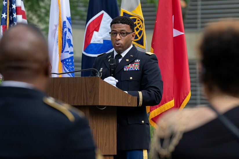 Lt. Col. Emanuel Dudley, U.S. Army Financial Management Command chief of Operations, delivers remarks as Sgt. Maj. Ronald Houston, USAFMCOM Operations senior enlisted advisor, and Shani Adams-Houston listen during the sergeant major’s retirement ceremony at the Maj. Gen. Emmett J. Bean Federal Center in Indianapolis July 17, 2020. Sergeant Major Houston was born and raised in New Orleans, Louisiana, and he joined the Army as a financial management specialist in May 1992, four days after graduating from high school. (U.S. Army photo by Mark R. W. Orders-Woempner)