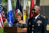 Shani Adams-Houston looks at her husband, Sgt. Maj. Ronald Houston, U.S. Army Financial Management Command Operations senior enlisted advisor, as she delivers special remarks congratulating him during his retirement ceremony at the Maj. Gen. Emmett J. Bean Federal Center in Indianapolis July 17, 2020. Sergeant Major Houston retired from the Army after more than 28 years of military service. (U.S. Army photo by Mark R. W. Orders-Woempner)