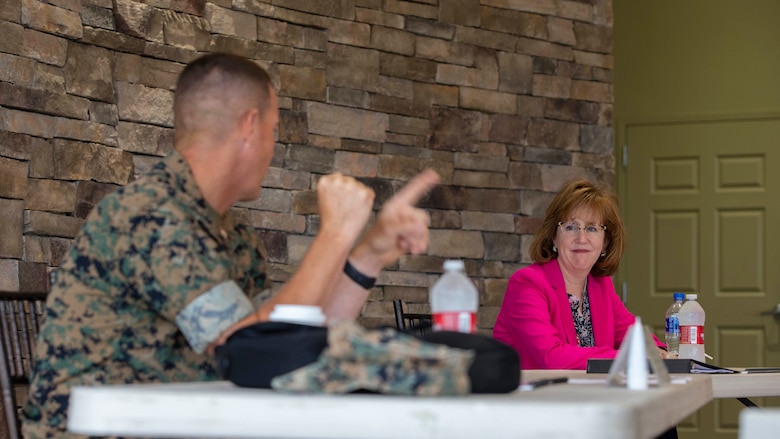 Assistant Secretary of the Navy for Manpower and Reserve Affairs (PTDO) Catherine Kessmeier, right, listens to U.S. Marine Col. Jeffery Holt, the deputy commander of Marine Corps Installations West, Marine Corps Base Camp Pendleton, at the Pacific Views Event Center on Camp Pendleton, California, July 28, 2020. Kessmeier visited Camp Pendleton to tour the base and engage with Marine and Navy leaders to discuss and encourage efforts related to suicide prevention, mental health awareness, and supporting military families. (U.S. Marine Corps photo by Lance Cpl. Andrew Cortez)