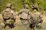 A team of Joint Terminal Attack Controllers (JTACs) from the Latvian National Armed Forces, look over the terrain while conducting close air support training during Northern Strike 20 at Camp Grayling, part of the National All-Domain Warfighting Center in Northern Michigan during Northern Strike 20, July 28, 2020.