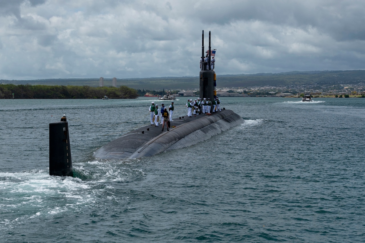 A submarine floats on the ocean’s surface.